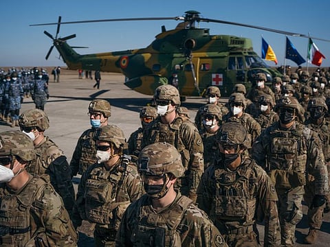 US military personnel from the Allied nations deployed to Romania take part in a ceremony during a visit of the Nato Secretary General and Romanias President at the Mihail Kogalniceanu Military Base on February 11, 2022 in Mihail Kogalniceanu, Romania. 