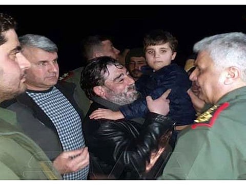 Fawaz with his father after release. 