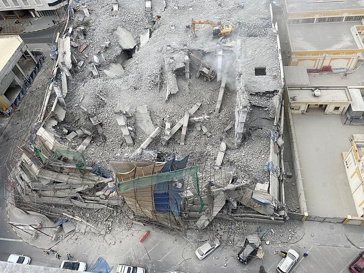 cars-damaged-under-building-being-demolished-in-sharjah-1644757012487