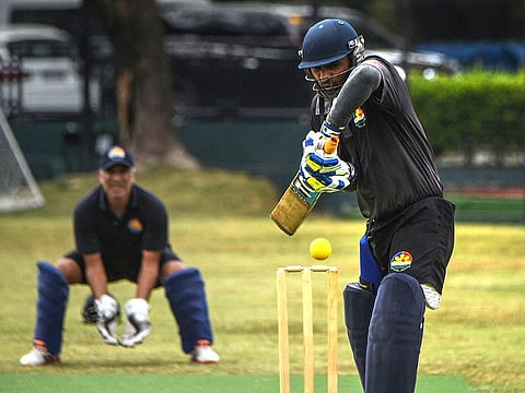 Vimal Kumar (R) of the Philippines national cricket team batting during a team training session at the United Club pitch in Paranque City in suburban Manila.