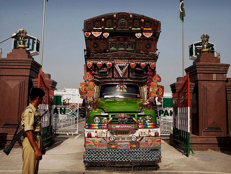  A truck enters into India from Pakistan through Wagah Border, India, on June 13, 2011. Pakistan is allowing nuclear rival India to deliver tons of wheat to Afghans struggling through intensifying food shortages, two Foreign Ministry officials said Monday.