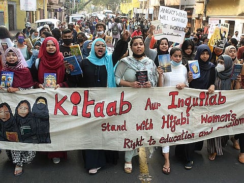 Women stage a protest in Kolkata on Wednesday over the hijab ban imposed in colleges in Karnataka.  