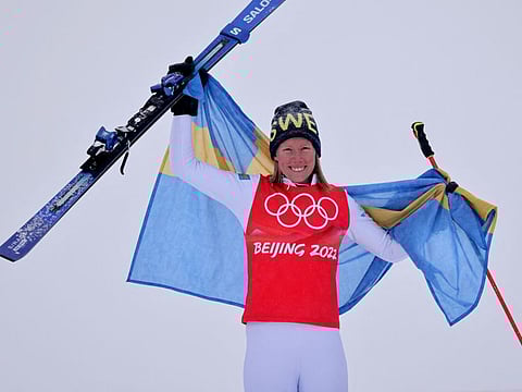 Gold medalist Sandra Naeslund of Sweden celebrates during the flower ceremony.