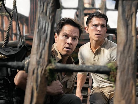 Mark Wahlberg and Tom Holland in Uncharted (2022)
