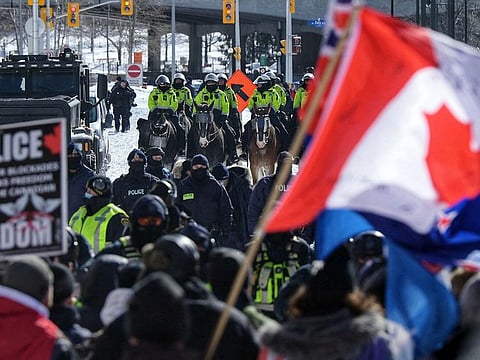 Police confront demonstrators against Covid-19 mandates in Ottawa on February 18, 2022.