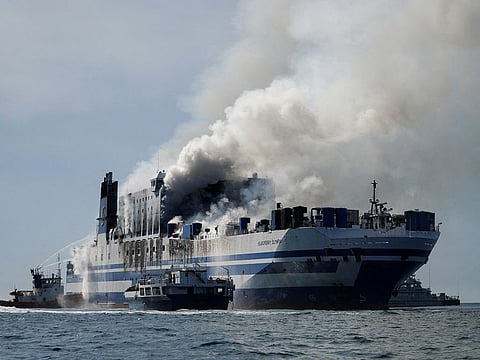 Smoke rises from the burning Italian-flagged Euroferry Olympia, after a fire broke out on the ferry, off the island of Corfu, Greece, February 18, 2022. 