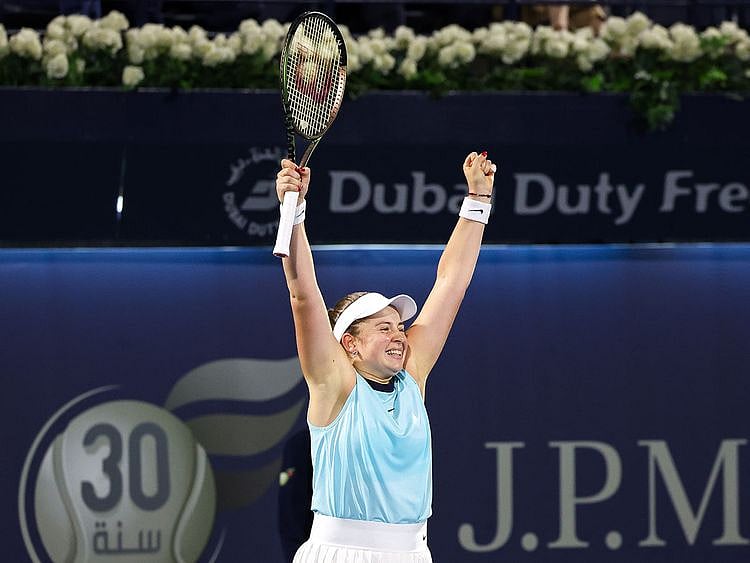 Jeļena Ostapenko celebrates after defeating Veronika Kudermetova in the Dubai Duty Free Tennis Championships final