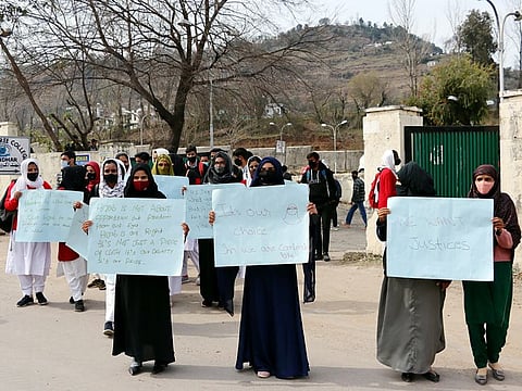 Students hold placards during a protest at Government Degree College, Mendhar, in Poonch district of Jammu and Kashmir on Friday. 