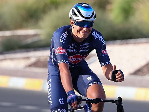 Jasper Philipsen of Alpecin-Fenix celebrates after crossing the finish line during the first stage of the UAE Tour in Madinat Zayed in Abu Dhabi.