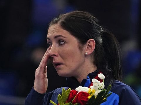 Britain's Eve Muirhead, from the gold medalist team, cries during a medal ceremony for the women's curling at the Beijing Winter Olympics in Beijing.