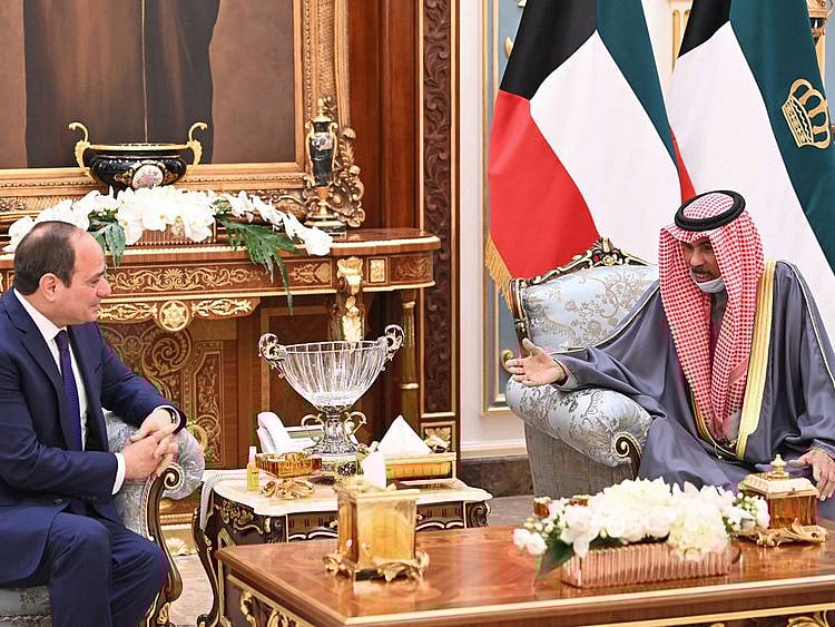 A photo provided by the Kuwaiti news agency KUNA shows Kuwait's Sheikh Nawaf Al Ahmed Al Sabah receiving Egypt's President Abdel Fattah Al Sissi in Kuwait City on February 22, 2022.