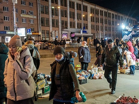 Street vendors sell vegetables and other local produce on the sidewalk outside Lukyanivska Metro station in Kyiv, Ukraine, on February 22, 2022. 