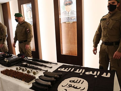 Lebanese Internal Security Forces (ISF) show weapons the ministry of interior said were seized from the Daesh cell that was planning attacks on targets in Beirut's southern subrubs, during a press conference in the Lebanese capital on February 23, 2022. 