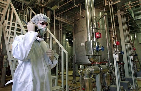 An Iranian security officer at a Uranium Conversion Facility just outside the city of Isfahan, Iran.