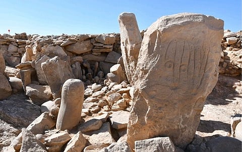 This photo provided by Jordan Tourism Ministry shows two carved standing stones at a remote Neolithic site in Jordan’s eastern desert.  A team of Jordanian and French archaeologists said on February 22 that it had found a roughly 9,000-year-old shrine.  
