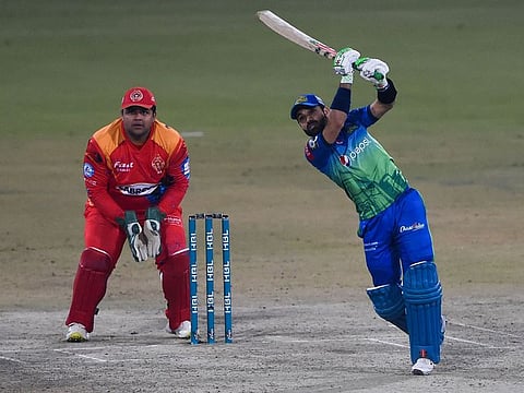 Multan Sultan skipper Mohammad Rizwan plays a lofted drive during the Pakistan Super League match against Islamabad United at the Gaddafi Cricket Stadium in Lahore.