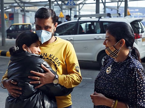 An Indian student meets with her family members as she returns from Ukraine following advisories from the Indian embassy at Indira Gandhi International Airport, in New Delhi on Thursday. 