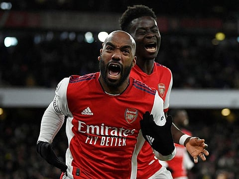Arsenal's Alexandre Lacazette celebrates the winner with Bukayo Saka.