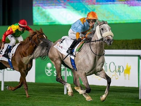 First Classs, ridden by Ronan Thomas, winning the Al Mneefah Cup presented by The Ministry of Culture