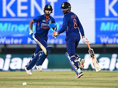 Shreyas Iyer (left) and Ravindra Jadeja cross over during their hurricane partnership of 58 in the second T20 International in Dharamsala.