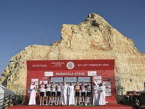 At the top: Team UAE Emirates, along with Tadej Pogacar, at Jebel Hafeet after the Slovenian won the UAE Tour on Saturday.