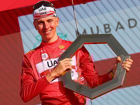 Tadej Pogacar celebrates on the podium after winning the UAE Tour along with the seventh stage from Al Jahili Fort to Jebel Hafeet.