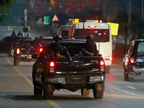 A special unit of the Pakistani security forces escorts a convoy of vehicles carrying the Australian cricket team towards their hotel upon their arrival in Islamabad, Pakistan.