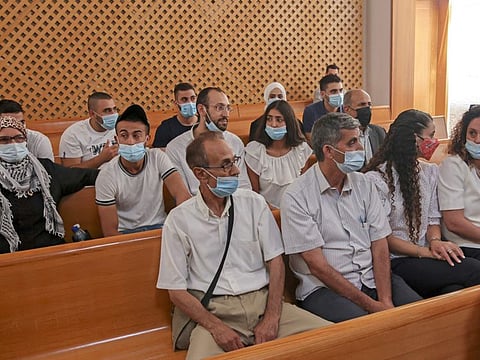 In this file photo taken on August 2, 2021, Palestinian residents of the Sheikh Jarrah neighbourhood attend a hearing at Israel's supreme court in Jerusalem on the case of Palestinian families facing expulsion by Israeli colonists in annexed east Jerusalem. 
