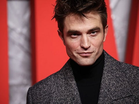 Robert Pattinson poses for photographers upon arrival for the screening of the film 'The Batman' in London on Wednesday, February 23, 2022.