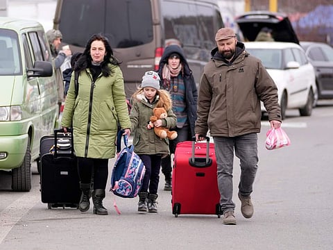 Refugees from Ukraine arrive to the border crossing Vysne Nemecke, Slovakia, Tuesday, March 1, 2022.