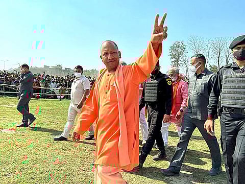 Uttar Pradesh Chief Minister Yogi Adityanath shows victory sign at a public meeting for the sixth phase of Uttar Pradesh Assembly elections, in Siddhartha Nagar on Tuesday. 