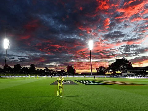 Beth Mooney of Australia fielding on the boundary as the sun sets during the ICC Women's Cricket World Cup 2022 cricket match against England 