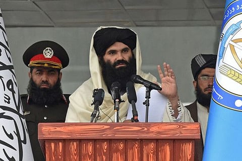 Taliban Interior Minister Sirajuddin Haqqani speaks to new Afghan police recruits during a graduation ceremony at the police academy in Kabul on March 5, 2022.  