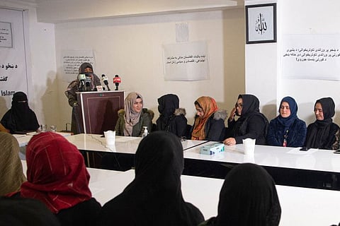 Members of the Afghan women's peace and freedom organisation listen to a speaker during an event on the occasion of International Women's Day in Kabul on March 8, 2022. 