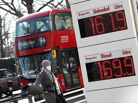 Increased petrol and diesel prices are on a display board at a filling station, in London, on March 8, 2022. 