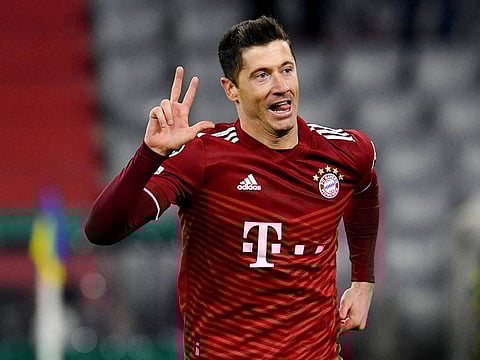 Bayern Munich's Robert Lewandowski celebrates completing his hat-trick.