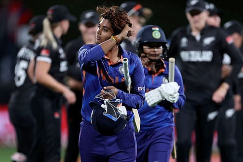 Indias Meghna Singh walks off the field with teammate Rajeshwari Gayakwad after their loss during the 2022 Women's Cricket World Cup match against New Zealand at Seddon Park in Hamilton.
