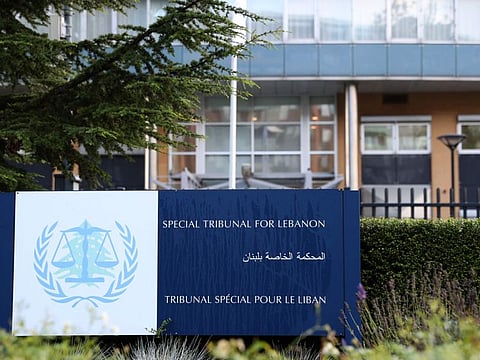 This file photograph taken on August 18, 2020, shows a sign in front of the building of the UN-backed Special Tribunal for Lebanon (STL) at Leidschendam.