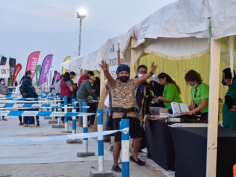 Participants at registration desk during the Gulf News OverNighter Fun Drive 2022 at Tilal Swaihan. 