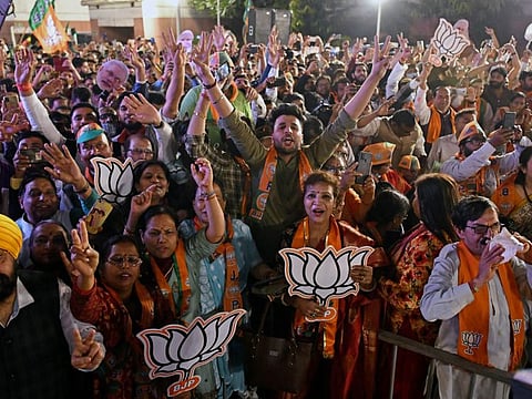 BJP supporters at the BJP Headquarters celebrate the party's win in Assembly elections of Uttar Pradesh and others states, in New Delhi on Thursday, Mar 10, 2022.