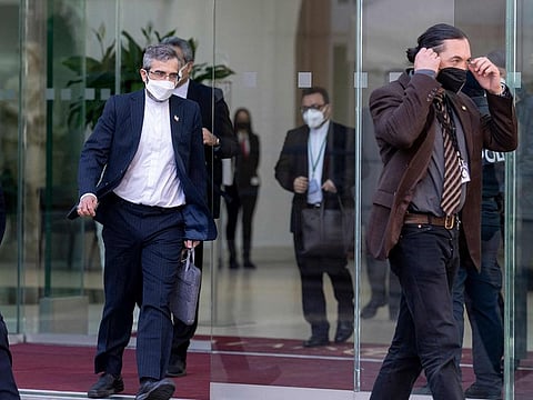 Iran’s chief nuclear negotiator Ali Bagheri Kani (left) leaves the Coburg Palais, the venue of the Joint Comprehensive Plan of Action (JCPOA), after his meeting with Deputy Secretary General of the European External Action Service (EEAS) Enrique Mora, in Vienna on March 11, 2022.  