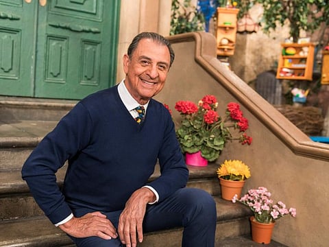 In this photo provided by Sesame Workshop, Emilio Delgado poses for a picture at Kaufman Astoria Studios while filming the 50th season of "Sesame Street," in October 2018.