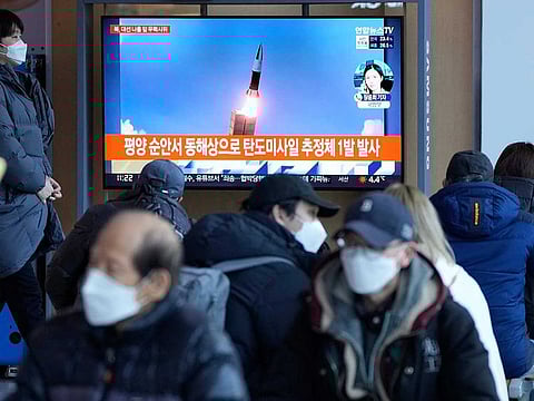 File: People watch a TV showing a file image of North Korea's missile launch during a news programme at the Seoul Railway Station in Seoul, South Korea, March 5, 2022.