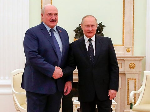 Russian President Vladimir Putin, right, and Belarusian President Alexander Lukashenko pose for a photo during their meeting in Moscow, Russia, Friday, March 11, 2022.