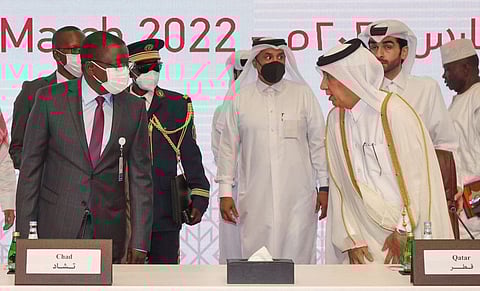 Qatar's Minister of State for Foreign Affairs Sultan bin Saad Al Muraikhi (right) greets Chad's Prime Minister Albert Pahimi Padacke at the start of the Chad Peace Negotiations in Qatar's capital Doha, on March 13, 2022. 