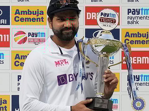 Indian skipper Rohit Sharma poses with the winners' trophy after wrapping up the Test series against Sri Lanka 2-0.