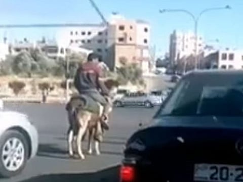  Motorists were seen in the video looking at the man with approval as he waited at the signal. 