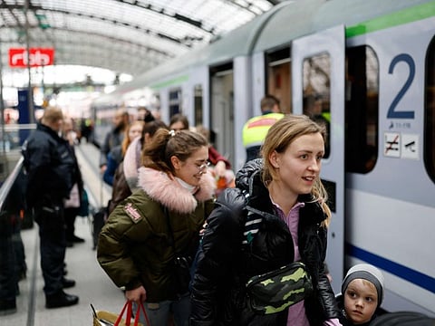 Ukrainian refugees disembark a train from Warsaw after arriving at the main railway station (Hauptbahnhof) in Berlin on March 14, 2022.