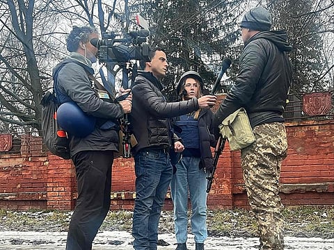 This undated image courtesy of Fox News shows from left: cameraman Pierre Zakrzewski, US journalist Trey Yingst and Ukrainian journalist Oleksandra "Sasha" Kuvshynova reporting in Ukraine.  