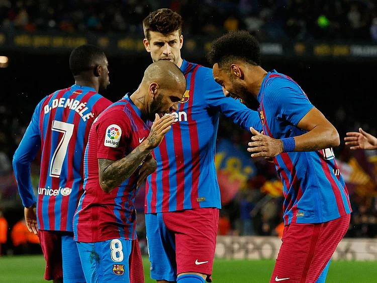 Barcelona's Pierre-Emerick Aubameyang, Dani Alves and Gerard Pique 